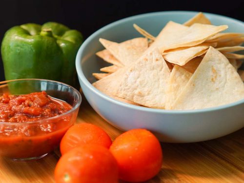 Copycat Chili's Tortilla Chips Recipe - crunchy baked flour tortilla chips with salsa dip