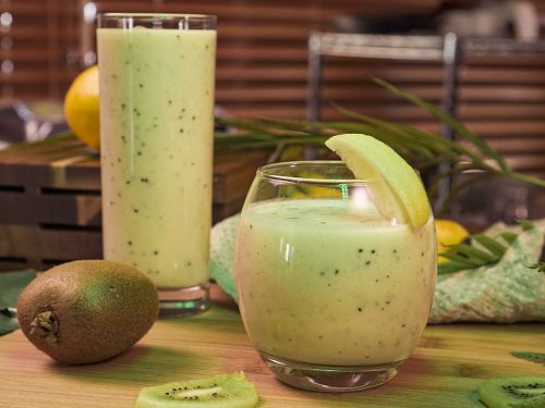 Emerald City Smoothie Recipe (Copycat), banana kiwi smoothie with lemon wedges