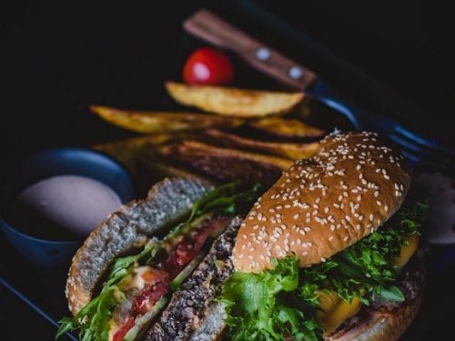 Bacon Cheeseburger (Red Robin Copycat) - homemade juicy bacon cheeseburger with meaty patties, crispy bacon, and gooey cheese, chips on the side