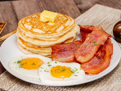 Classic Sunny Side Up Eggs with Bacon and Pancakes