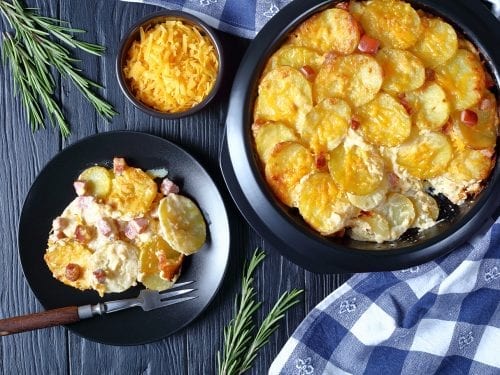 Cheesy Scalloped Potatoes and Ham Casserole Recipe, homemade scalloped potatoes and ham with cheese, sauteed onions, and milk