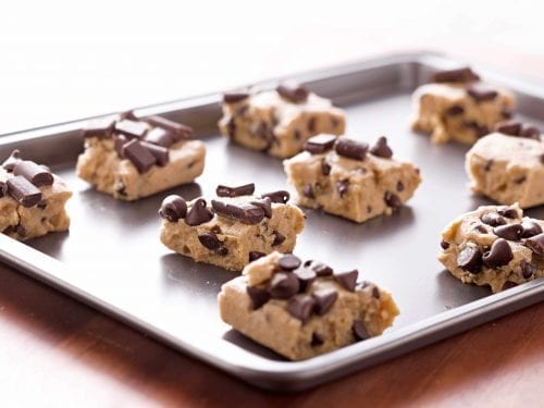 chunks of cookie dough on a baking sheet