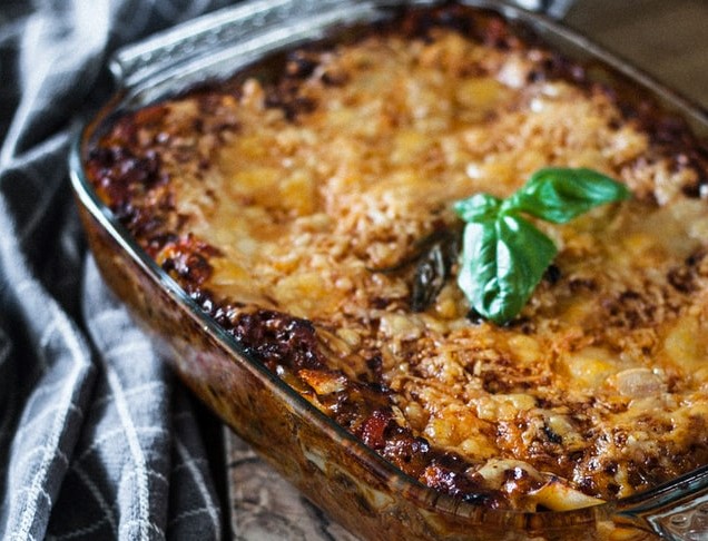 emeril's lasagna of fresh spinach corn and crab with goats cheese sauce