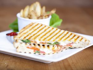 classic tomato arugula cheese panini