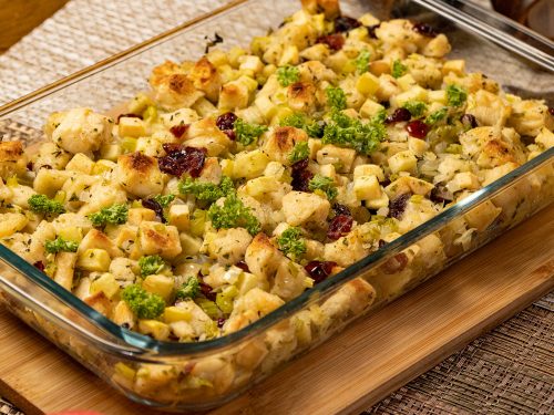 Apple Cranberry Rosemary Stuffing Recipe. Stuffing filled with cranberries, apples, and rosemary; served on a baking casserole