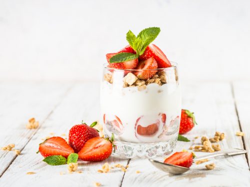 Greek yogurt with fresh strawberry and granola. Parfait.