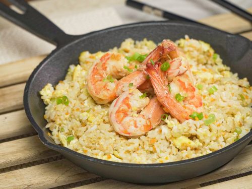 Shrimp Fried Rice Recipe, Fried rice topped with shrimp and served on a cast iron skillet