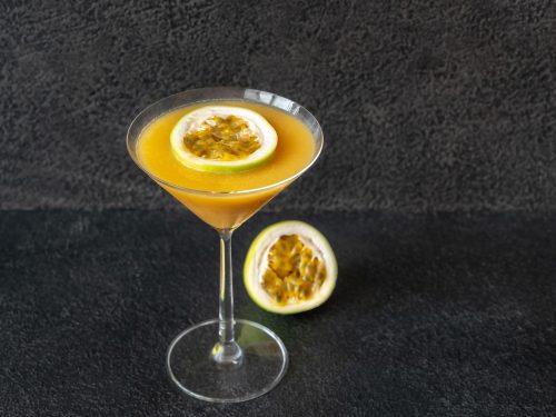 Pornstar Martini Recipe, Passionfruit cocktail topped with fruit slice