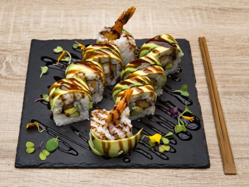 Dragon Roll Recipe, homemade dragon roll sushi with grilled eel, shrimp tempura, and avocado toppings