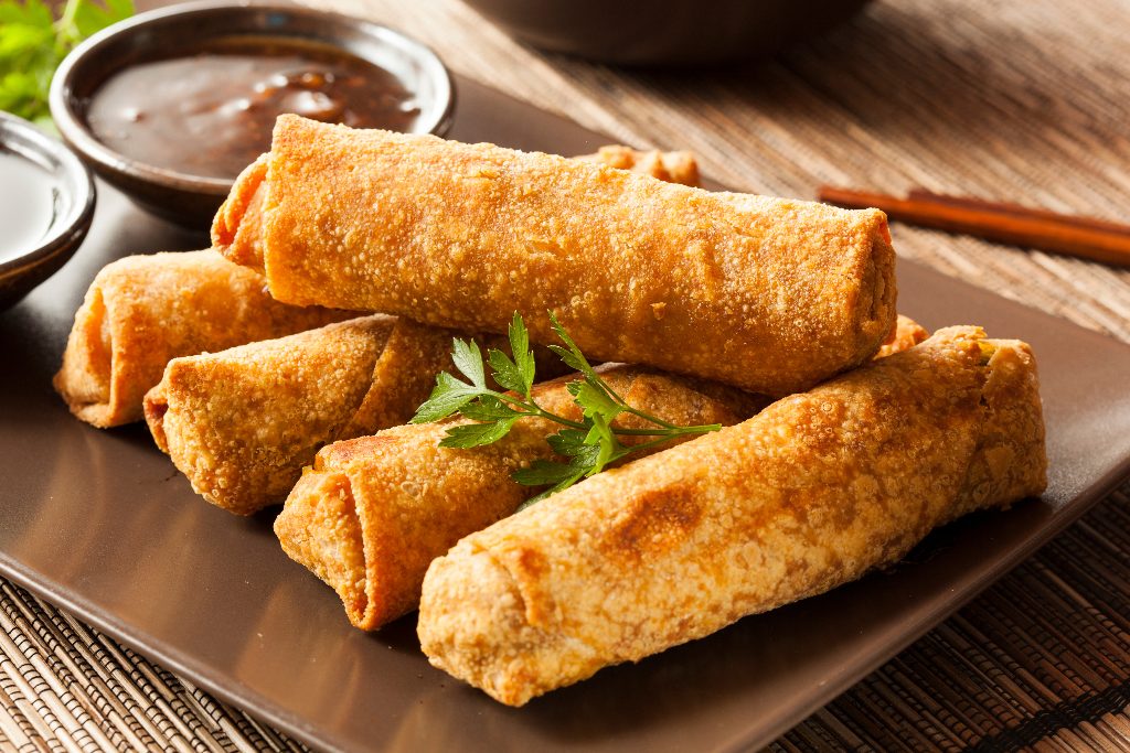 Plate of deep-fried Chinese egg rolls, egg roll vs spring roll