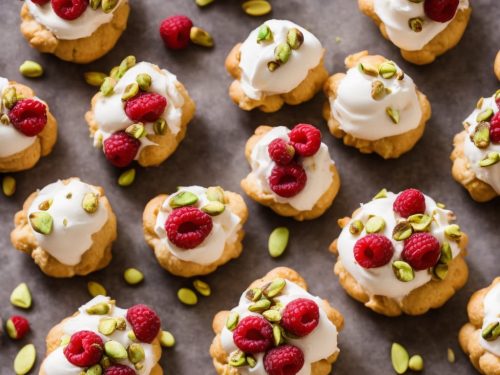 Raspberry, white chocolate & pistachio profiteroles