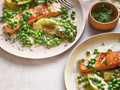 Stir fry of green peas with grilled salmon