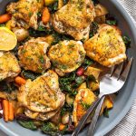 skillet chicken thighs with potatoes, carrots, and greens recipe