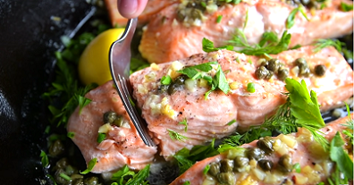 poached salmon with caper-butter sauce