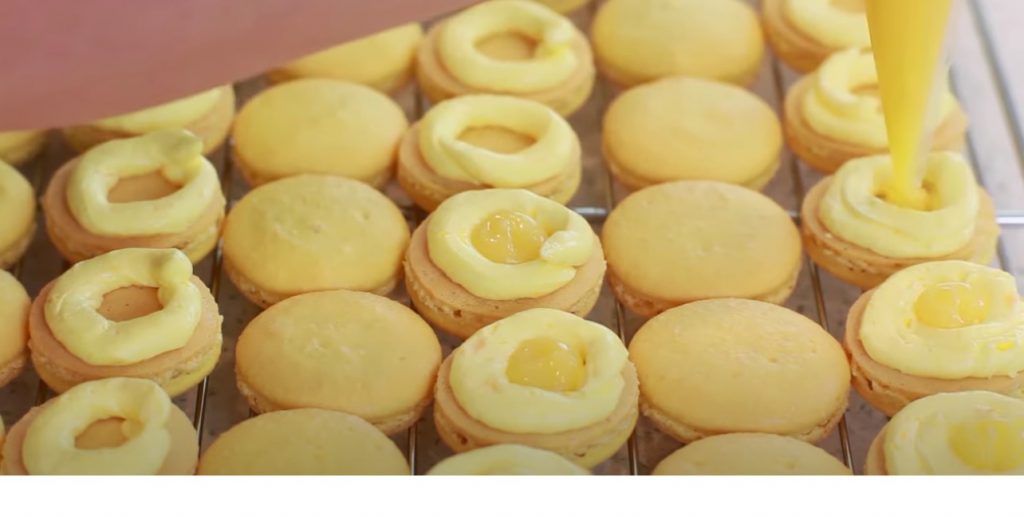 lemon macarons on a wire rack